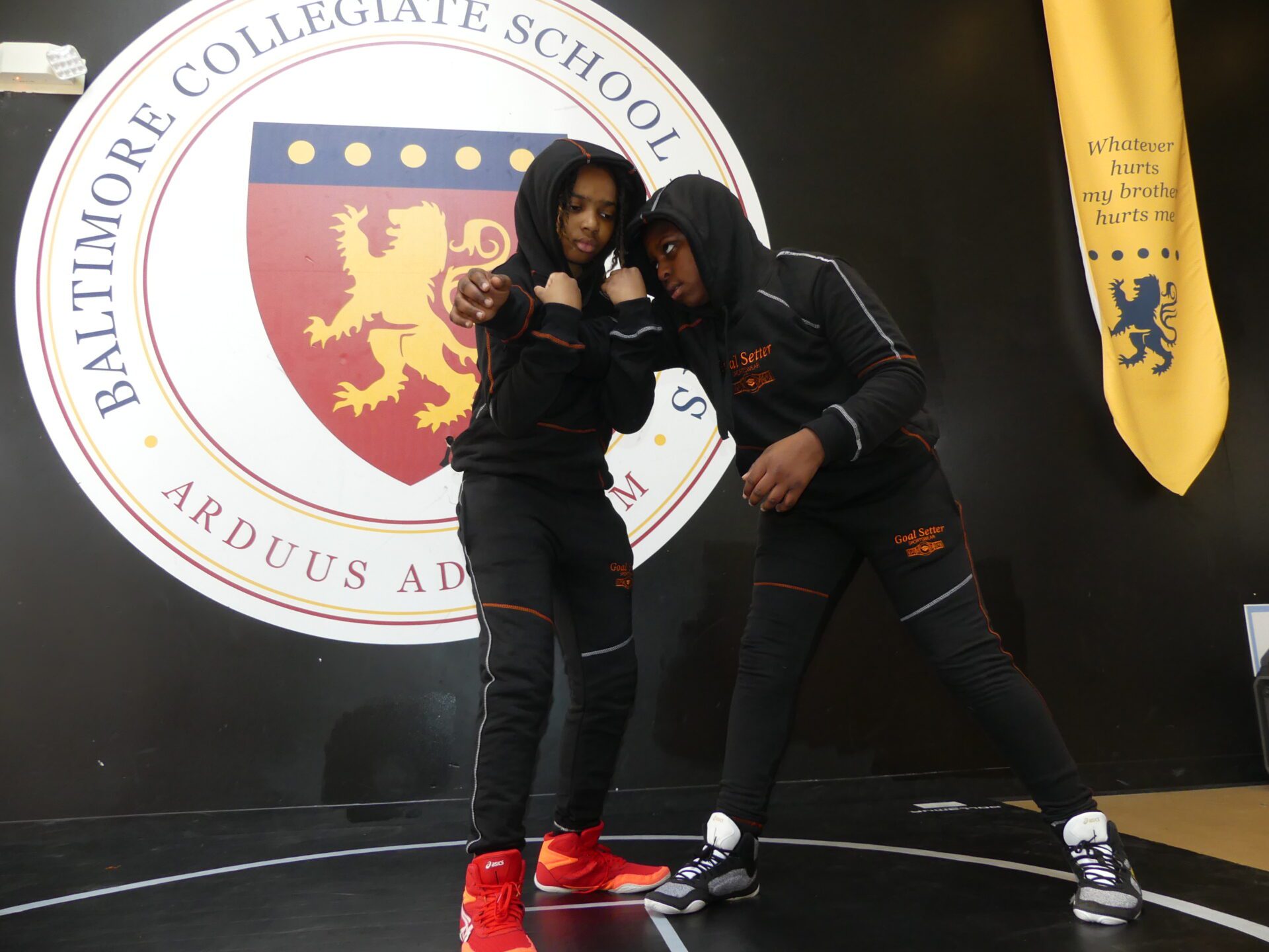 Two young boys practice martial arts